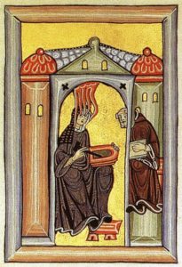 Hildegard von Bingen empfängt eine göttliche Inspiration und gibt sie an ihren Schreiber weiter. Miniatur aus dem Rupertsberger Codex des Liber Scivias